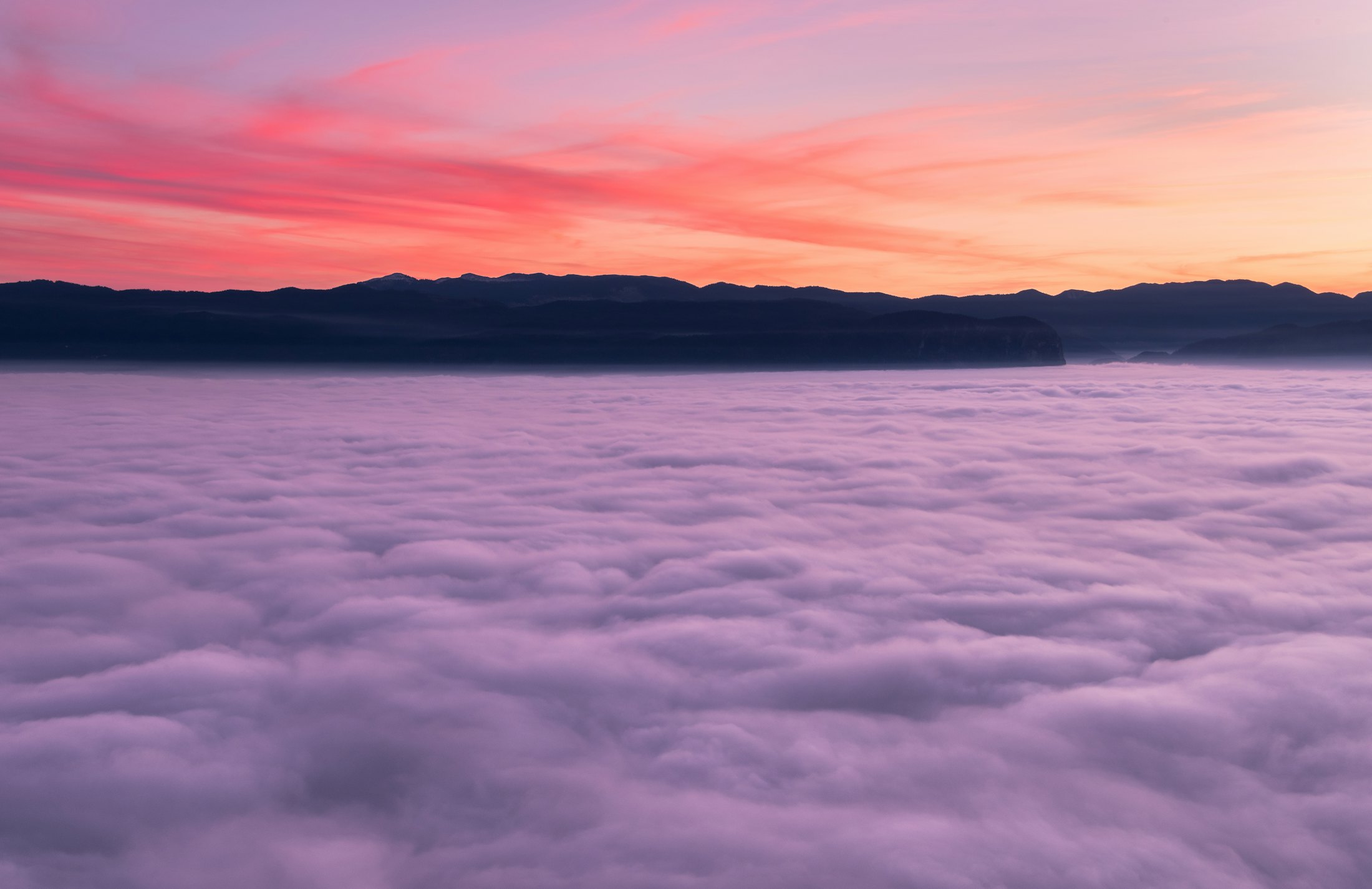 A sea of clouds at dusk seen from above