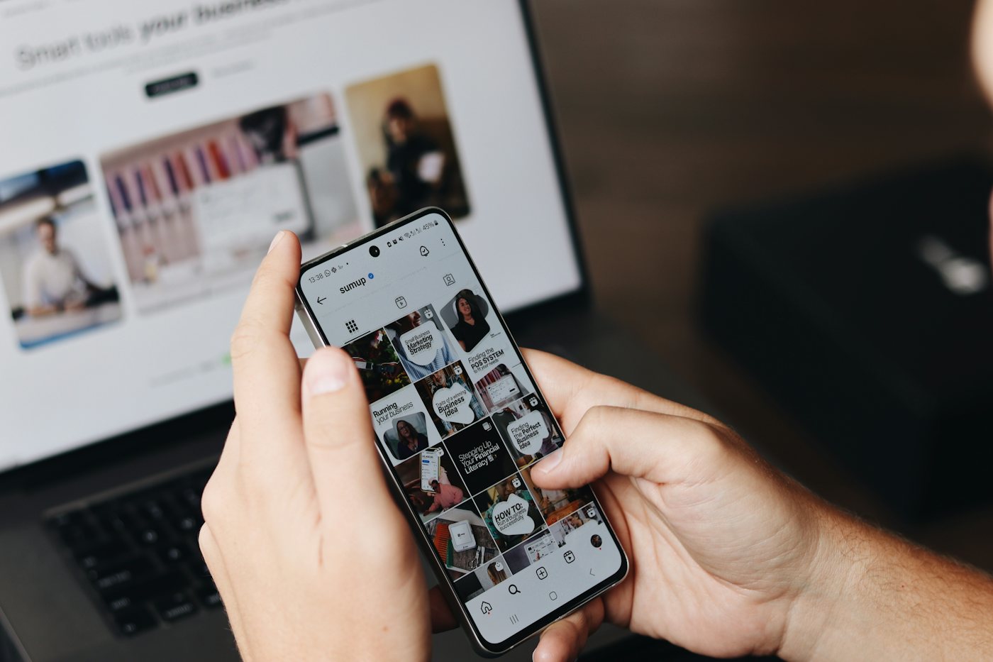 A person scrolling a social media feed on a phone