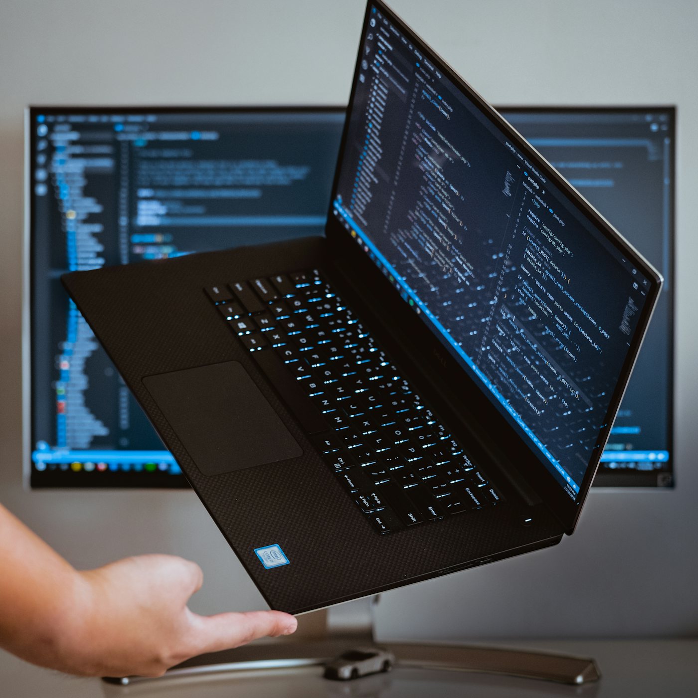 A laptop showing source code